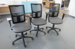 Three matching swivel arm chairs