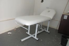 Masage bed with pump action rise and fall