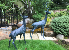 PAIR LARGE MATCHING CAST METAL DEERS IN VERDI BRONZE FINISH