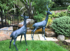LARGE PAIR CAST METAL DEERS IN VERDI BRONZE FINISH