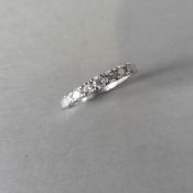 0.43ct diamond band ring. 7 brilliant cut diamonds