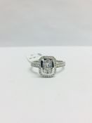 0.33ct diamond set solitaire style ring. rectangular setting with small round cut diamonds