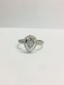 0.33ct diamond set solitaire style ring. Pear shape setting with small round cut diamonds