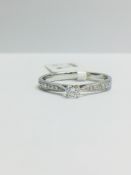 9ct White Gold diamond Solitaire Ring with Diamond set shoulders
