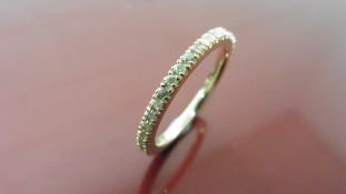 0.50ct full claw set diamond band ring set in 14ct yellow gold.