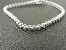 0.25ct illusion set diamond bracelet set in 9ct white gold. Small brilliant cut diamonds
