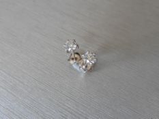 0.75ct Solitaire diamond stud earrings set with brilliant cut diamonds