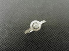 0.26ct diamond set solitaire style ring set in 9ct white gold.