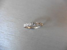 0.70ct diamond band ring set in 18ct gold. Brilliant cut diamonds.