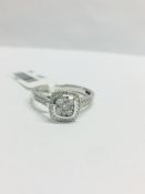 0.33ct diamond set solitaire style ring. Cushion cut setting with small round cut diamonds