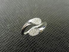 0.10ct diamond set crossover dress ring set in9ct white gold.