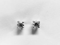 0.66ct Solitaire diamond stud earrings set with brilliant cut diamonds
