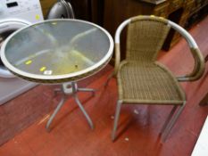 Small circular metal framed glass topped garden table and two matching chairs