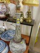 Large serpentine stone table lamp in the form of a lighthouse having steps carved into the base,