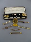 Collection of gold and yellow metal brooches, pins and earrings with a chased decorated circular