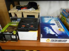 Selection of boxed Sega Gametrack and PS4 consoles and games systems including 'Guitar Hero Live'