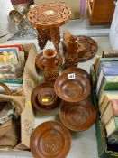 Two small Eastern carved folding wooden tables and a quantity of treen bowls etc