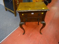 Two drawer occasional/bedside cabinet on carved legs