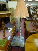 Modern wrought iron base coffee table with stone tiled top and a brass and onyx standard lamp E/T