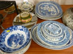 Collection of blue and white Willow pattern meat platters and plates with other decorative wall