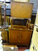 Modern reproduction entertainment unit with interior drawers and a similar fall front cocktail