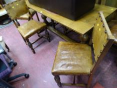 Good oak refectory dining table, 168 x 68 cms and six studded leather dining chairs with carved