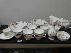 Three pieces of Aynsley 'Cottage Garden' ornamental ware, a Welsh Lady teapot, a bone china part