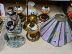 Stained glass effect lampshade, three branch ceiling light and a pair of modern Oriental figurines