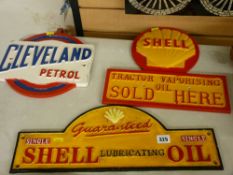Two Shell oil and one Cleveland petrol vintage style advertising signs