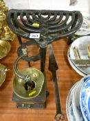 Two cast iron trivets, an antique brass and long handled iron pan with a vintage cast coffee
