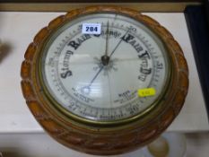 Oak framed aneroid barometer (glass cracked)