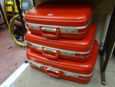 Graduating set of three vintage Spartanite travel cases in vibrant red