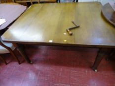 Oak extending dining table with two extra leaves on turned supports, 138 x 114 cms without leaves
