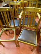 Three oak dining chairs and a matching carver
