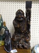 Carved Chinese wooden figurine and an African ebony example