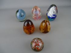 Six vintage standing paperweights having bubble and swirl inclusion