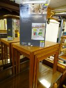 Teak nest of three tables and a boxed expandable under sink shelf