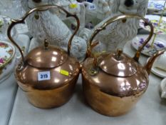 Near pair of Georgian copper kettles