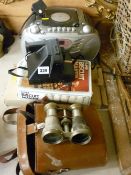 Portable disc player and radio, a Polaroid land camera, two pairs of binoculars etc