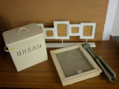 Metal bread bin, standing multi-portrait frame, a small wooden easel and a painted display case
