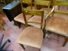 Polished wood drop leaf dining table and a set of six (five plus one) dining chairs