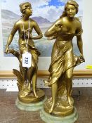 Pair of gilt painted spelter figurines on circular onyx bases after the originals by C H Perron