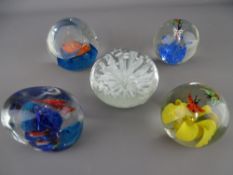 Five vintage glass paperweights having fish, butterfly and anemone decoration