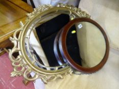 Vintage mahogany framed oval wall mirror and a fancy mid Century gilt example