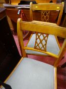 Yew single pedestal inlaid drop leaf dining table and two chairs
