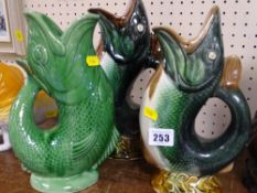 Two Majolica fish glug jugs and one other
