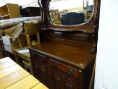 Bevelled edge mirror backed heavily carved sideboard with two drawers and two base cupboards
