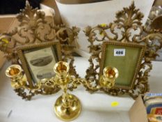 Pair of vintage cast metal portrait frames and a modern brass candelabra