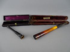 Two cased vintage cheroot/cigarette holders