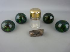 Four vintage paperweights, a carved hardstone buffalo and a silver topped smelling salts bottle